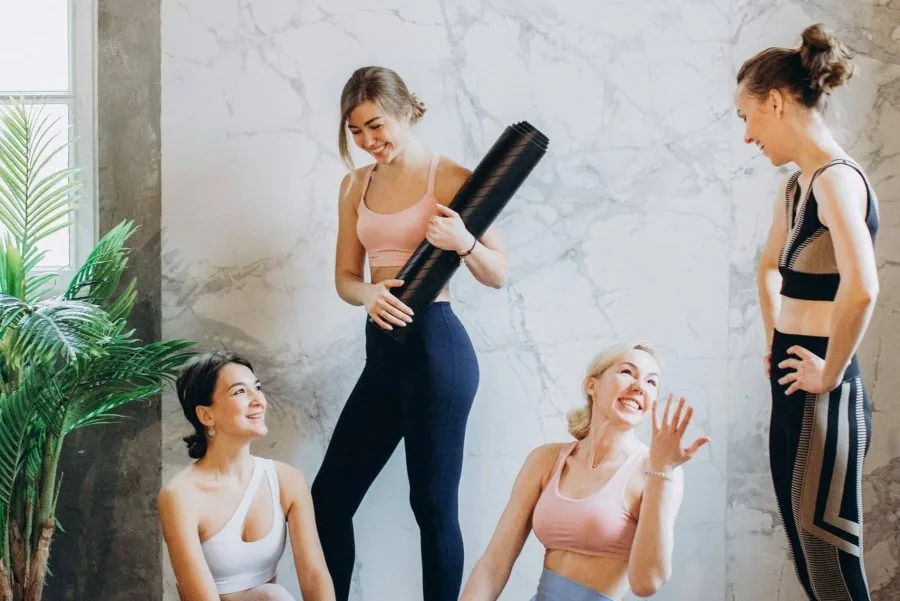 A welcoming group of students gathered before a yoga class